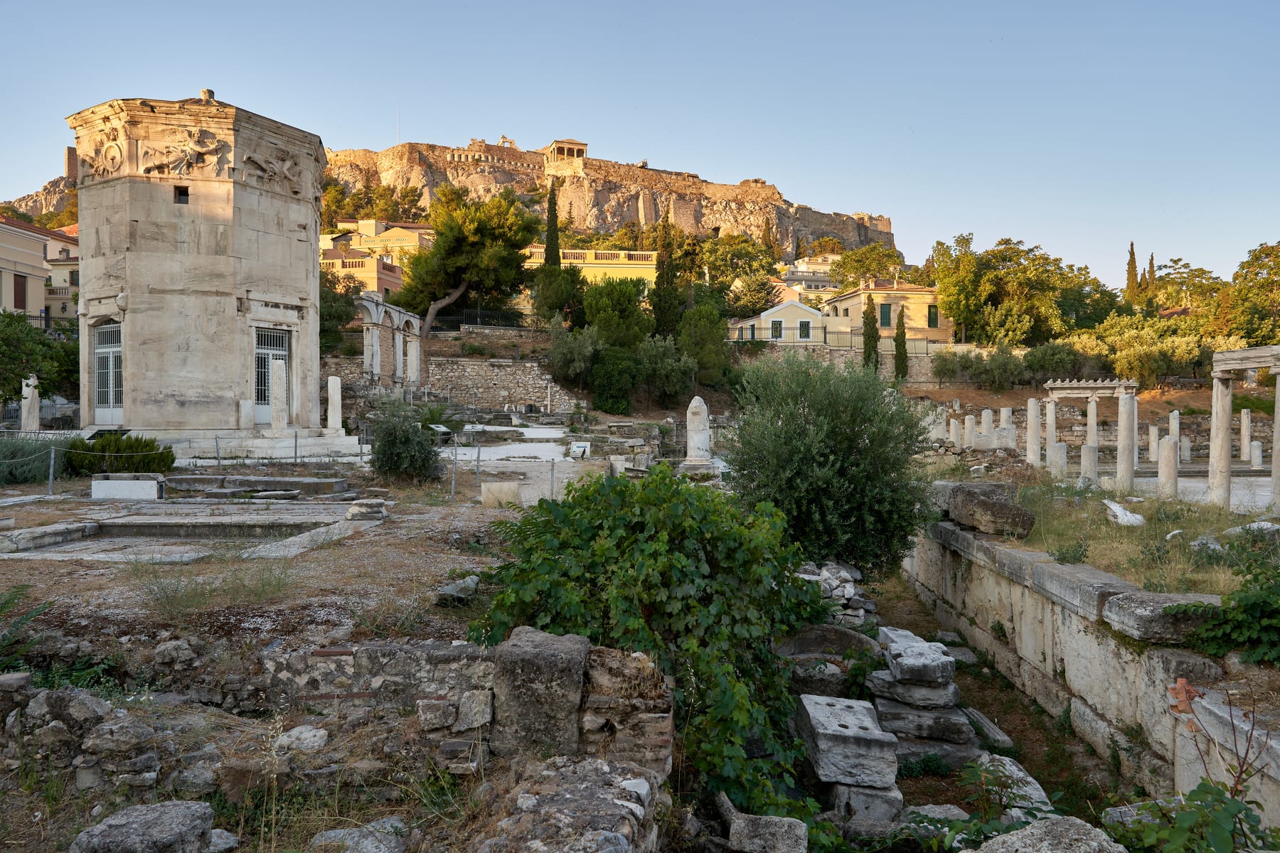 Exterior view of the octagonal Tower of the Winds in the Roman Agora, Athens, with its Pentelic marble frieze and sundial carvings.